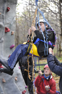 Young disable man climbing Shepley Bridge Marina using an adapted chair