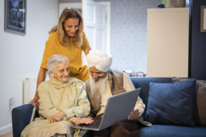 Later Life Goals - volunteer helping elderly couple
