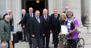 guy is greeted at freemasons hall after his journey