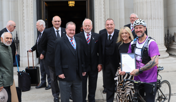 guy is greeted at freemasons hall after his journey